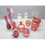 CRANBERRY GLASSWARE - an assortment and two square based glass decanters with stoppers ETC