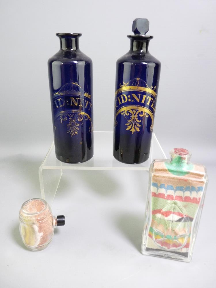 PAIR OF BRISTOL BLUE GLASS CHIMNEY SHAPED 'NITRIC ACID' JARS, (one stopper missing and chip to