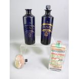PAIR OF BRISTOL BLUE GLASS CHIMNEY SHAPED 'NITRIC ACID' JARS, (one stopper missing and chip to