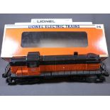 LIONEL ELECTRIC TRAINS O'GAUGE - a boxed Milwaukee Road R8-3 diesel engine in orange and black