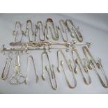 CLAW & OTHER EPNS SUGAR TONGS, two pairs of knife rests and a set of table nut crackers