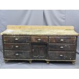 CIRCA 1850 PINE DRESSER BASE having seven drawers with central lower cupboard door with inverted