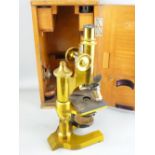 E LEITZ WETZLAR LACQUERED BRASS MICROSCOPE, No 61709, in fitted carry case with additional lenses,