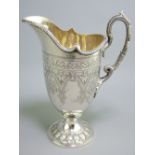 SILVER CREAM JUG, finely shaped, classical bright cut style with scrolled handle and circular