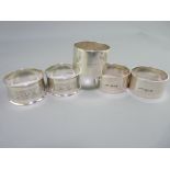 TWO PAIRS OF SILVER NAPKIN RINGS and one other, Chester and Birmingham hallmarks, all 1920s dates,