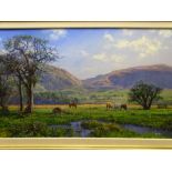 PHILLIP STANTON oil on canvas - titled 'Grazing in the Valley, Caernarfon', signed, 49.5 x 85cms