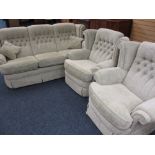 LOUNGE SUITE comprising three seater sofa and two armchairs in a classically patterned pastel