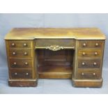 PEDESTAL DESK-DRESSING TABLE with breakfront and carved detail