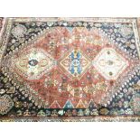 IRAN 100% WOOL PILE RUG - red and blue ground, traditional woven pattern in a central block with