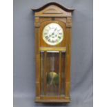 PENDULUM WALL CLOCK of plain form with silver dial, bevelled glass panelled front and D.P marked