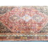 TRADITIONAL IRAN 100% WOOL PILE RUG - red ground with central diamond block pattern and multi-