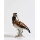 Schnepfe.20. Jh. Porzellan, naturalistisch bemalter Vogel. Marke Ens, Nr. 7485. H: 22 cm.- - -20.