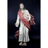 Herz-Jesu-Figur, Holz fast vollrund geschnitzt, deutsch, 19. Jh., auf viereckiger Plinthe stehend,
