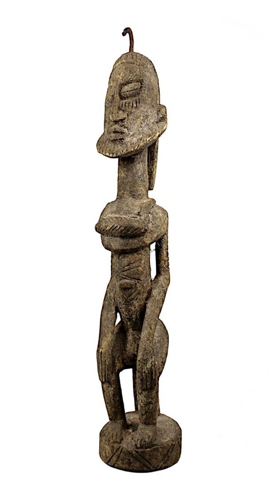 Männliche Figur der Dogon, Mali, Holz aus einem Stück geschnitzt, mit krustiger Patina, sitzende