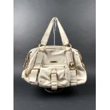 MICHAEL KORS. Sac besace en cuir grainé beige avec deux anses et une poche zipé sur [...]