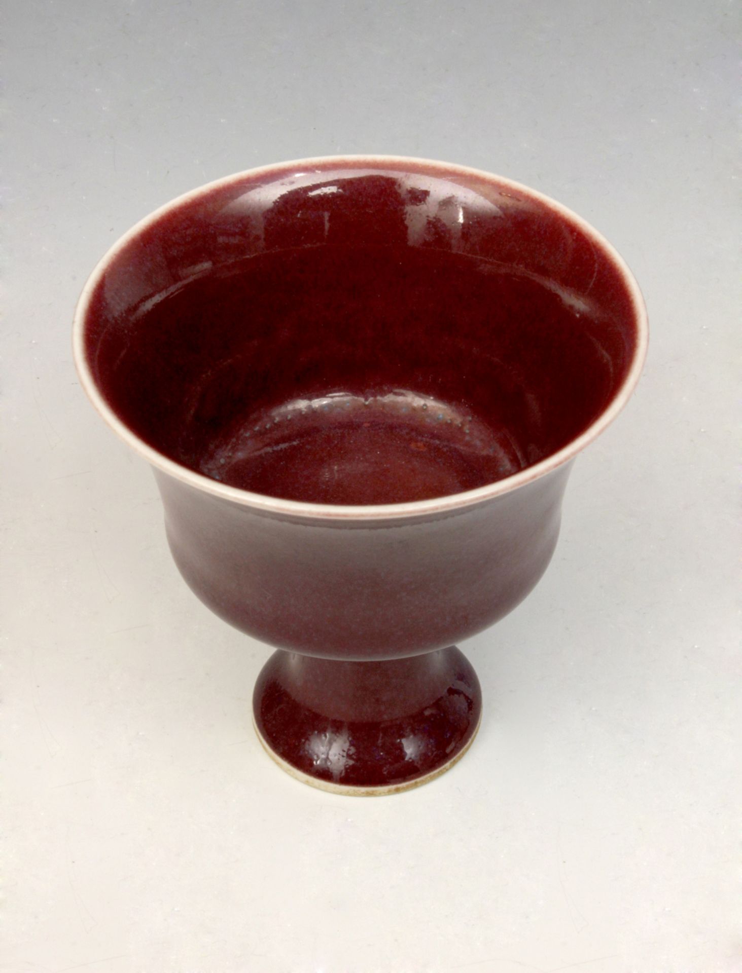 A 20th century Chinese sang du boeuf porcelain libation cup - Image 2 of 3