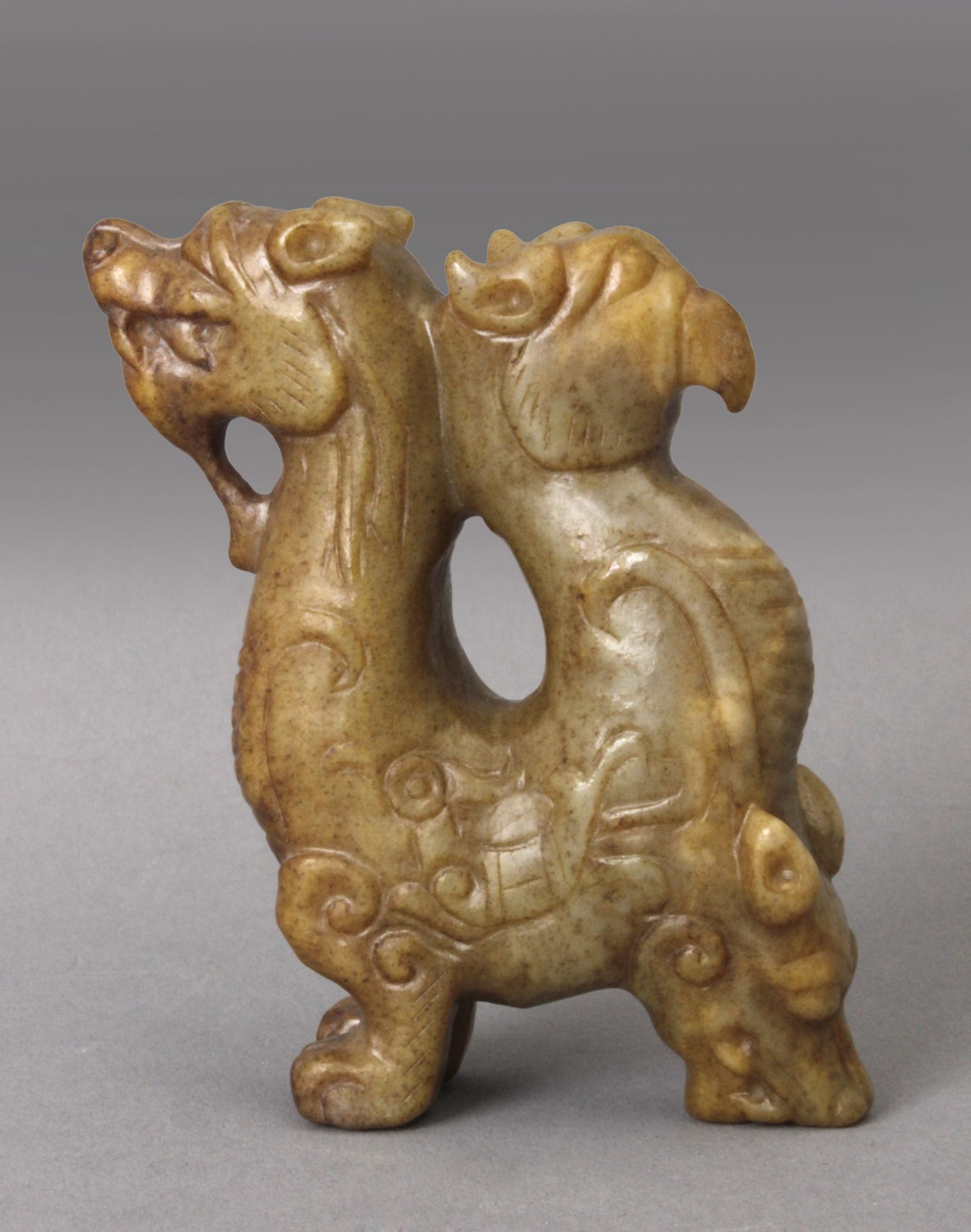 20th century Chinese school. A carved jade figure