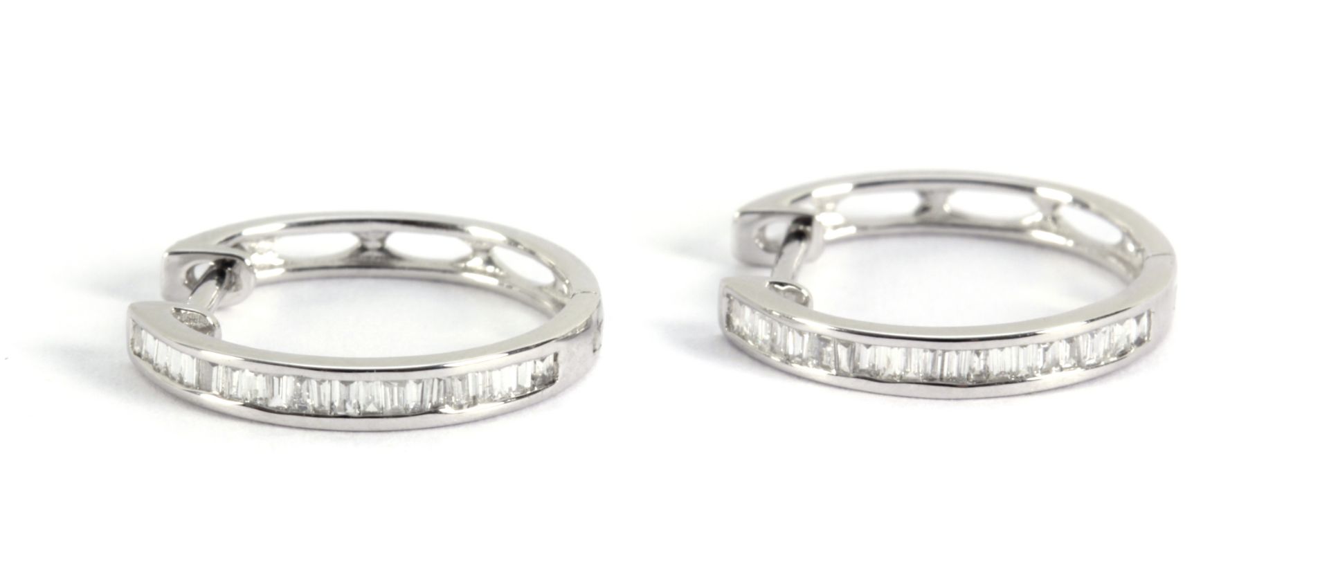 Baguette cut diamonds hoop earrings with an 18k white gold setting