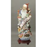 Chinese figure of a wiseman circa 1950 in Famille Rose porcelain