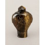 A 20th century Chinese carved tiger's eye quartz snuff bottle