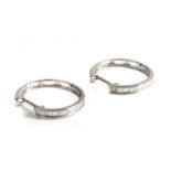 18k. white gold and baguette cut diamonds hoop earrings