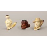 Three late 19th century pipes in carved meerschaum and wood