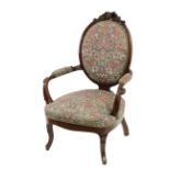 20th century mahogany nurse chair with flowery upholstery