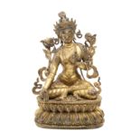 Late 19th century-early 20th century Tibetan school. Seated Buddha sculpture in gilt bronze