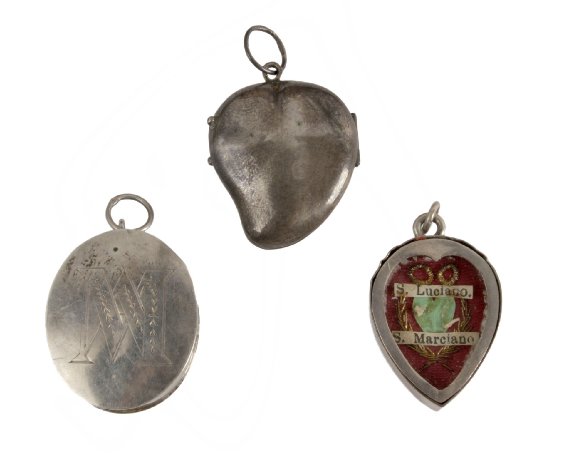 Three late 19th century-early 20th century silver reliquary pendants