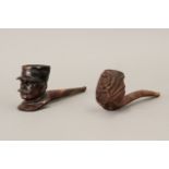 Pair of first half of 20th century German and French carved wood pipes