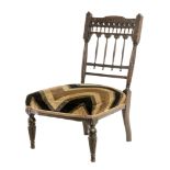 20th century carved walnut nurse chair