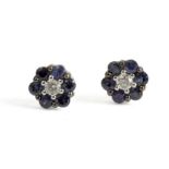 18k. white gold, oval cut sapphire and brilliant cut diamonds cluster earrings