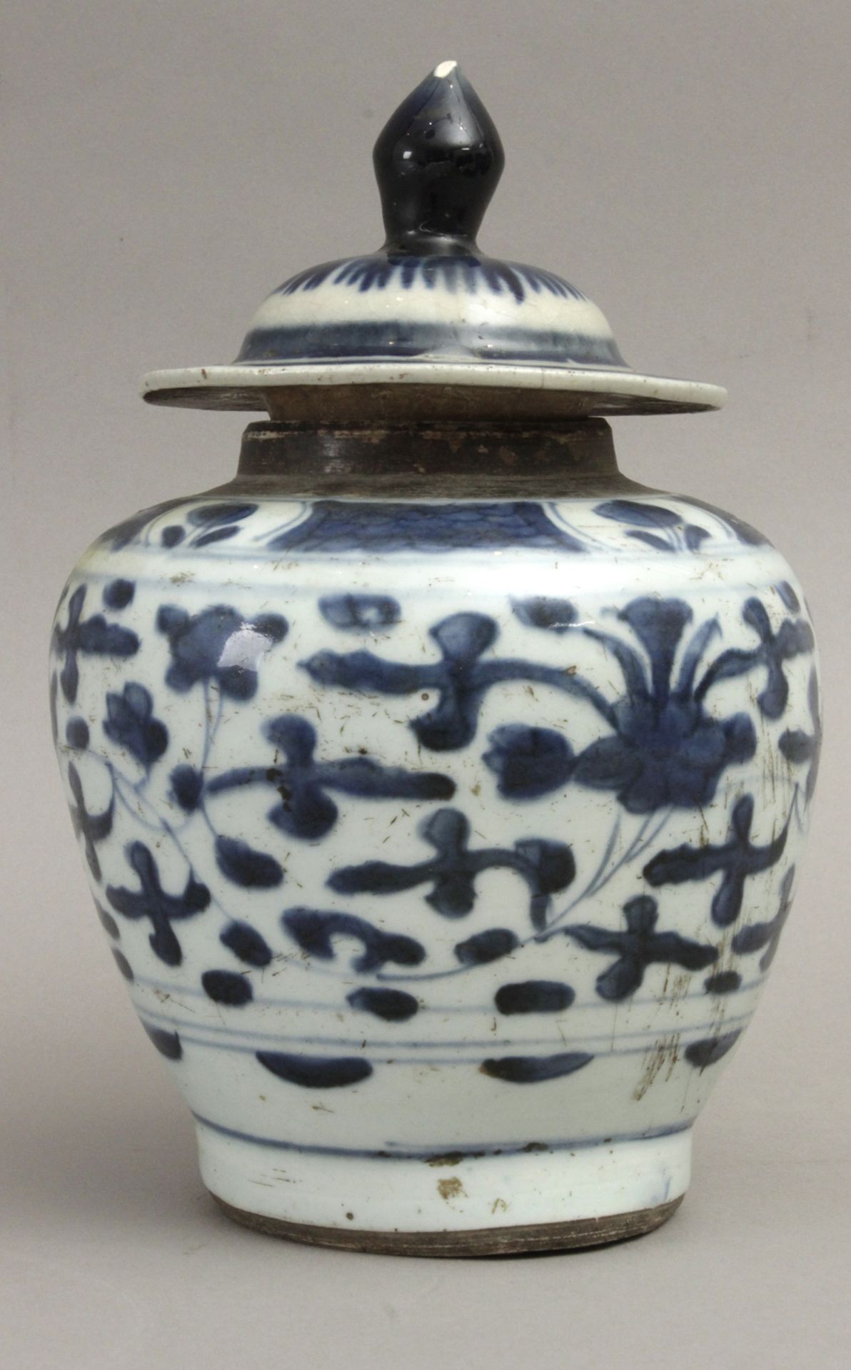 A late 19th century Chinese vase and cover in white and blue porcelain