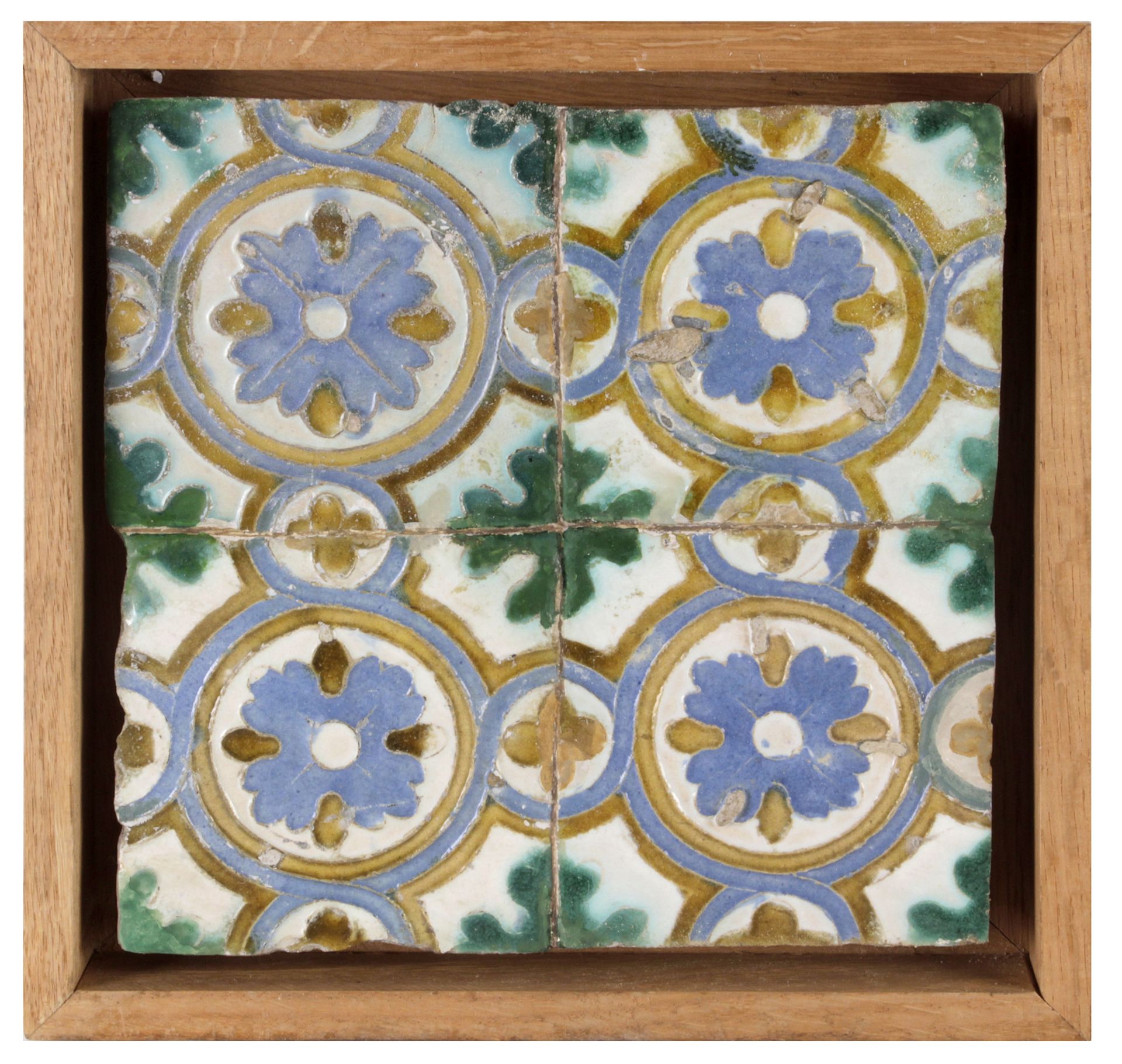 A wall plaque with four Catalan showing tiles from 16th-17th centuries