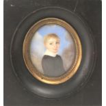 A 19th century English portrait miniature of a child