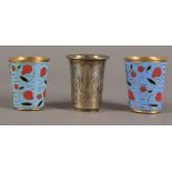 Late 19th century and 20th century set of three silver vodka shot glasses