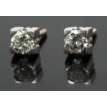 A pair of stud earrings with an 18 k. white gold setting and round brilliant cut diamonds