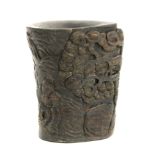 A 20th century buffalo carved horn libation cup