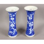 A pair of 19th century Chinese trumpet vases in white and blue porcelain