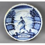 An 18th century Catalan plate in 'faixes i cintes' polychromed pottery