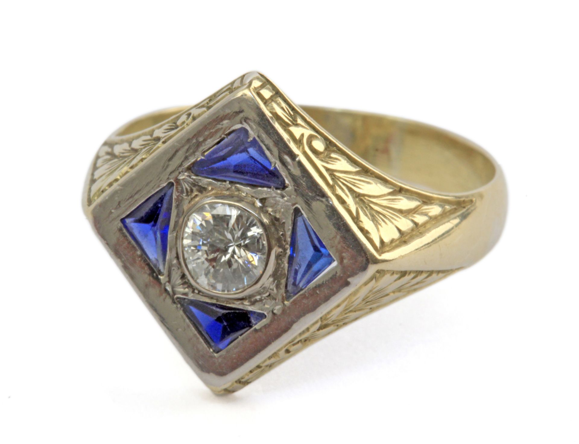 A signet ring with an 18 k. yellow gold and platinum setting and a point cut diamond