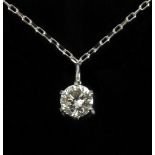 A 0,10 ct. round brilliant cut diamond pendant with a platinum setting and chain
