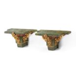 A pair of 20th century carved and polychromed brackets
