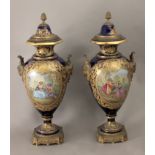 A pair of 18th century French vases and covers in Sévres porcelain garnished with gilt bronze