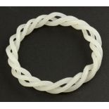 A 20 th century white jade twist bangle