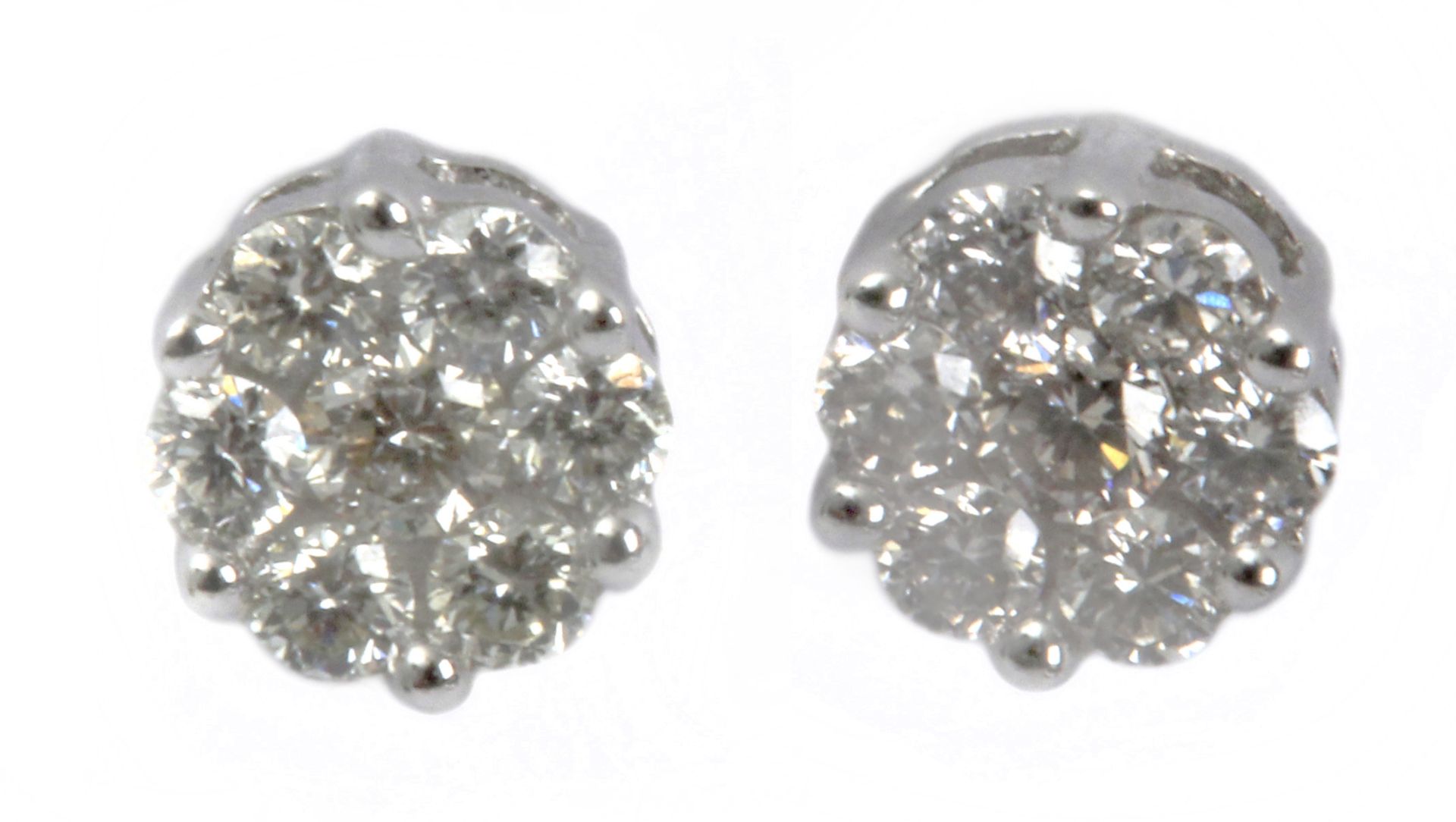 A pair of stud earrings with an 18 k. white gold setting and round brilliant cut diamonds