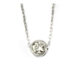 A 0,10 ct. round brilliant cut diamond bezel pendant with a platinum setting and chain