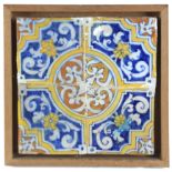 An early 17th century plaque with four Catalan showing tiles
