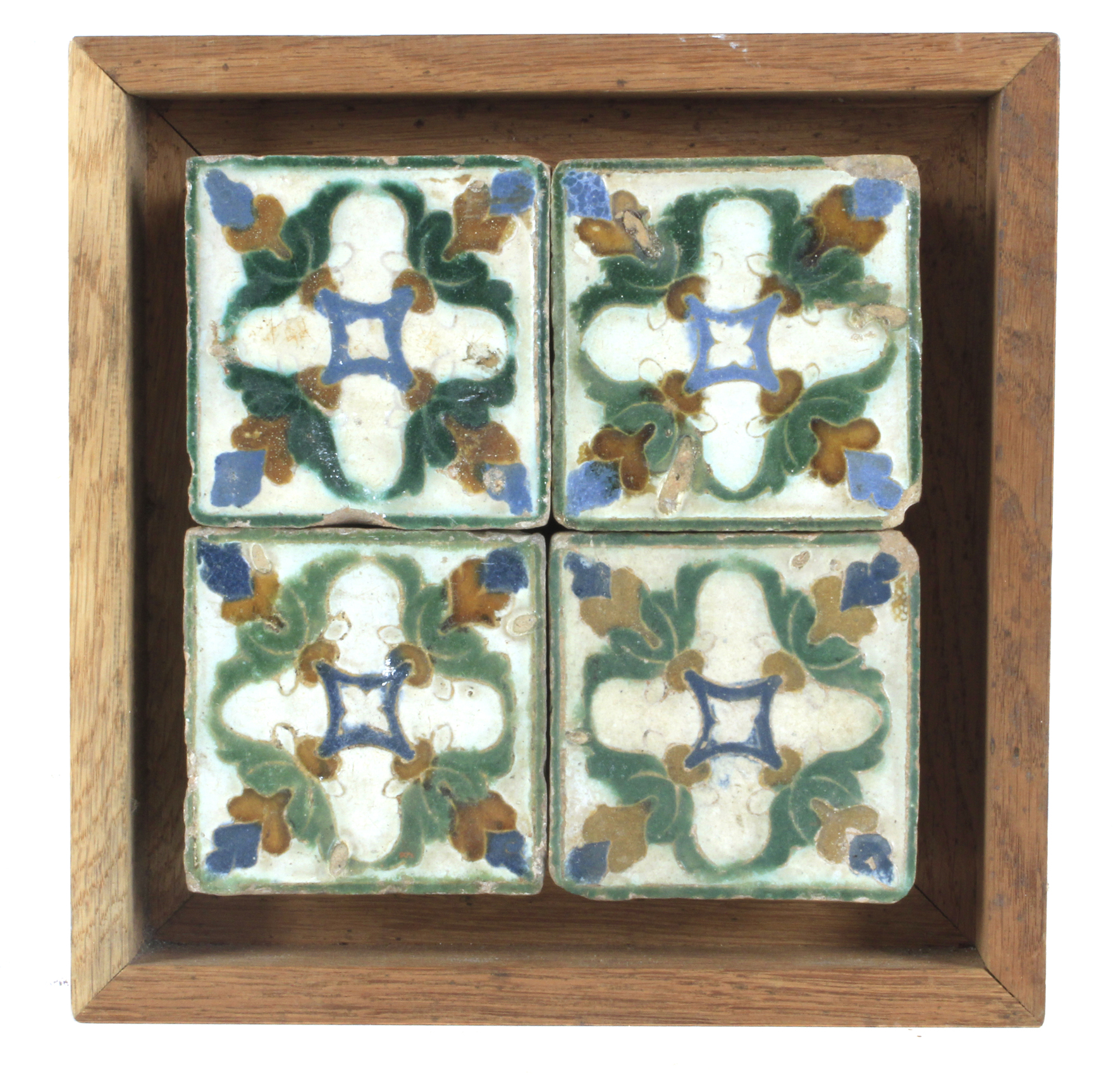 A 16th century plaque with four showing tiles probably from Toledo