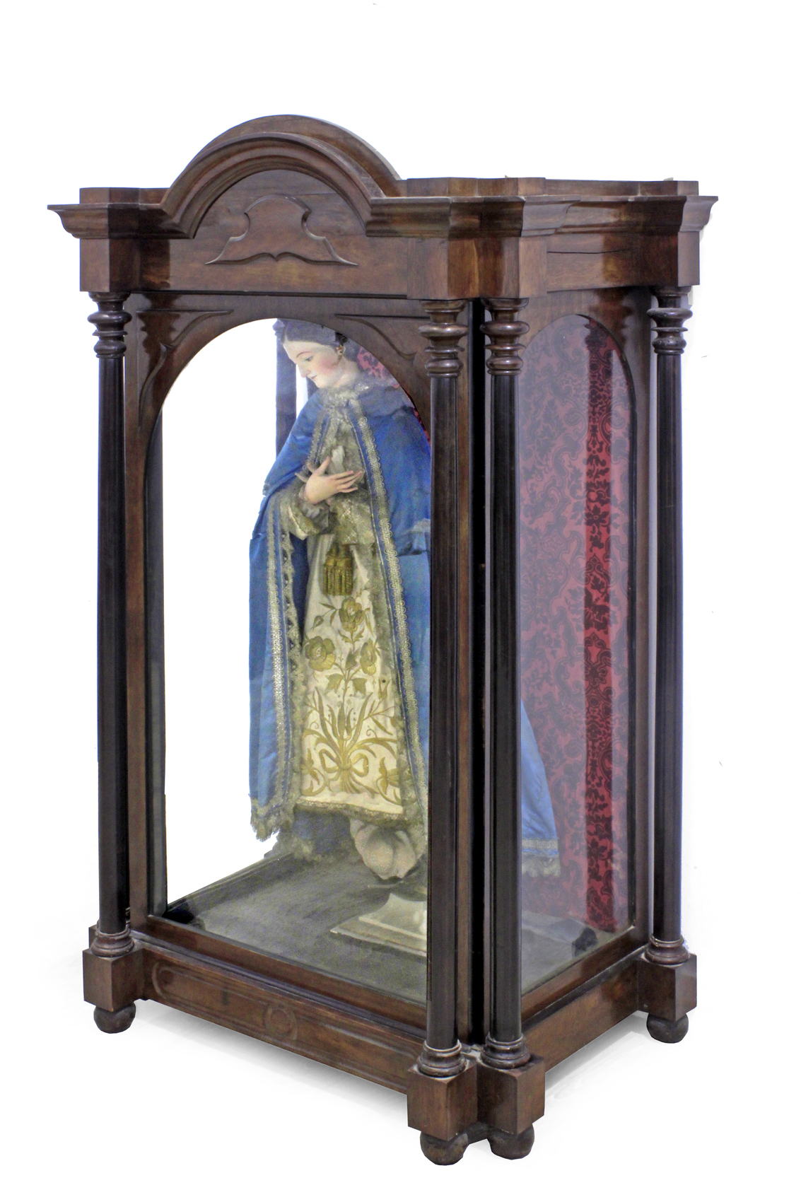 A 19th century Isabelino mahogany glass cabinet with a religious santos cage doll of the Virgin